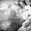 Excavation photograph -  Uprights of upper paved feature with drystone walling between trench 1/area A.
Photographic copy of polaroid print. Copied 1995.