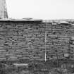 Survey photograph : site 35b - agricultural/storage unit, with small sub-structure at east end.  Drystone construction, partially surviving turf roof.