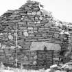 Survey photograph : site 51b - internal division, with fireplace, between Rooms II and III of earlier domestic structure.