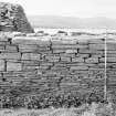 Survey photograph : site 51c - northern end of front elevation of agricultural building of drystone construction.