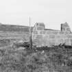 Survey photograph : site 48 - remains of Nissen hut with surviving concrete floor, and evidence of stone flagged path with kerbs.