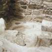 Excavation photograph.  Cell 13 excavated showing inner wall.
