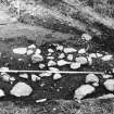 Excavation photograph : cobbles, area J.