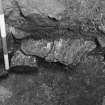 Excavation photograph - section through basal fill of small cellar 107