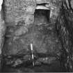 Excavation photograph - section through basal fill of small cellar 107