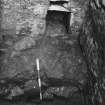 Excavation photograph - section through basal fill of small cellar 107