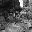 Excavation photograph - Detail of blocking 105 in doorway to NW stairs