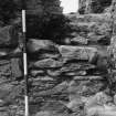 Excavation photograph - Detail of blocking 105 in doorway to NW stairs