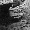 Excavation photograph - W Aumbry in cellar 107