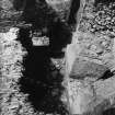 Excavation photograph - Barrel vault and cellar 107 below Stairway at NW