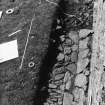 Excavation photograph - Paving surviving to S of tower