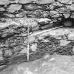 Excavation photograph : probable beam slot on N side of tower, from SE.