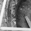 Excavation photograph : close up of shelf in W wall of tower.