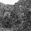 Excavation photograph : close up of junction of N tower and E range, from NE.