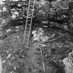 Excavation photograph : interior of tower after removal of all infilling debris, revealing wall foundations f110, from N.