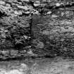 Excavation photograph : N tower - tower wall showing blocked doorway on left, from N.