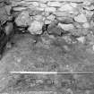 Excavation photograph : fireplace after removal of sand f213 showing underlying clay f214, from S.