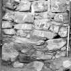 Excavation photograph : detail of masonry at back of fireplace, from S.