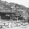 Excavation photograph : recently built masonry of S wall supported after partial collapse, from N.