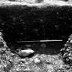 Excavation photograph : Section through feature 7, 008 897, trench A 6, 7, 25; from north.