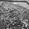 Excavation photograph : cairn from above - south-west sector, cleaned to structural level.