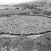 Excavation photograph : cairn cleaned to cobbled surface from south-west.