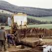 Sketewan, excavation of cairn. Lifting of massive cist-slab: Roger Mercer directing.