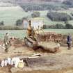 Sketewan, excavation of cairn. Lifting of massive cist-slab: Roger Mercer directing.