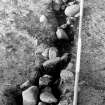 Excavation photograph.  Feature 1.  Palisade trench mid-section looking NW.