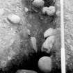 Excavation photograph.  Feature 1.  Palisade trench mid-section looking towards entrance.