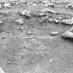 Excavation photograph : area 4 - f4011, L4015 Hut K, looking NE.
