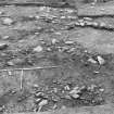 Excavation photograph : area 4 - f4041, 4044, Hut J, from W.
(inaccurate direction in photographic register)