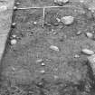 Excavation photograph : area 4 - Hut K, from S, in foreground.
