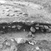 Excavation photograph : area 2 - f2048, west bank, Hut H, from N.