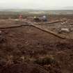 Excavation photograph : area 2 - Hut H, working shot, from NE.