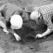 Staved wooden bowl being excavated.