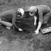 Staved wooden bowl being excavated.