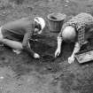 Staved wooden bowl being excavated.