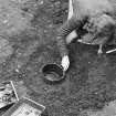 Staved wooden bowl being excavated.