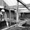 Surveying in progress in attic area.