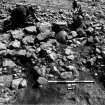 Excavation photograph : F8040 - mini cairn below 8045.