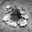 Excavation photograph : cist A after removal of food vessel.