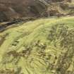Oblique aerial view of settlement site and burial ground at Cladh Maireannaich, Strath Brora, Sutherland, looking S. 