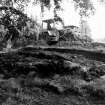 Excavation photograph : machining away topsoil, from west.