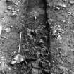 Excavation photograph : lower stones within 1m trench.