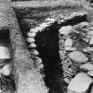 Excavation photograph : narrow passage and adjoining trench.