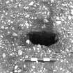 Excavation photograph : trench III - posthole AFL, half sectioned, part of post structure A.