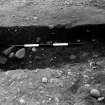 Excavation photograph : trench IV - feature DAH, eastern-most ring-ditch, cut 12, axial.