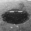 Excavation photograph : trench II - posthole fBAO, half section, facing north.