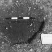 Excavation photograph : trench II - posthole BAV, 5cm off west half section, facing east.